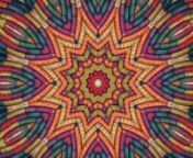 Mandala inspired by East African basketry pattern with a geometrically balanced spectrum of warm and cool colors ranging from peach to purple.