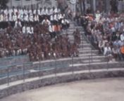 Archival footage shot by an amateur filmmaker while visiting South Africa, probably in 1981nnIt contains stock footage of people performing traditional South African dances: a show in an arena (at the time of apartheid colored and white people sit in separated tribunes), Zulu warriors playing Kpanlogo dance in the Goldreef City theme park, naked women in a tribe village dancing in front of tourists, and more.nnPlease, comment if you recognize more subjects.nnIf you want to buy this footage to us