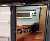 the queen size bed on the njstar off road luxury mobile camper trailer
