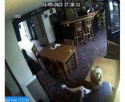 CCTV shows the moment Stephanie Langley, who is accused of murdering pub landlord Matthew Bryant, smashes a phone on a table in the Hare and Hounds