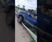 This man accidentally rammed his truck into a road&#39;s side railing. After the crash, he and a couple of people were seen struggling hard to get the vehicle off the railing but couldn&#39;t. Thankfully, nobody was injured.