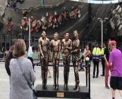 The &#39;four lads in jeans&#39; who rose to internet fame when their photo was turned into a meme have posed next to a statue in the spot the pic was taken in Birmingham in 2019