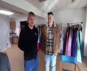 Businessman John Helm discusses his donation of over 100 prom dresses with Building Blocks owner Lee Nicholson.