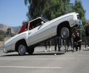 A car shop in California USA is creating custom lowrider cars that defy gravity. With just a flick of a switch, 3,000 pounds of metal bounces up and down eight feet in the air. Alex Tuason, 25, builds these cars at his fathers shop, Hoppos Custom Suspension Works in Ontario, California. Alex removes the coil springs from the car and replaces them with hydraulic cylinders. The hydraulic system is switch operated and controlled with a remote or dial on the dashboard.
