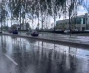 In Lake Forest, California, the streets overflowed with water after a thunderstorm and hailstorm. The cars drove by over the clogged roads.